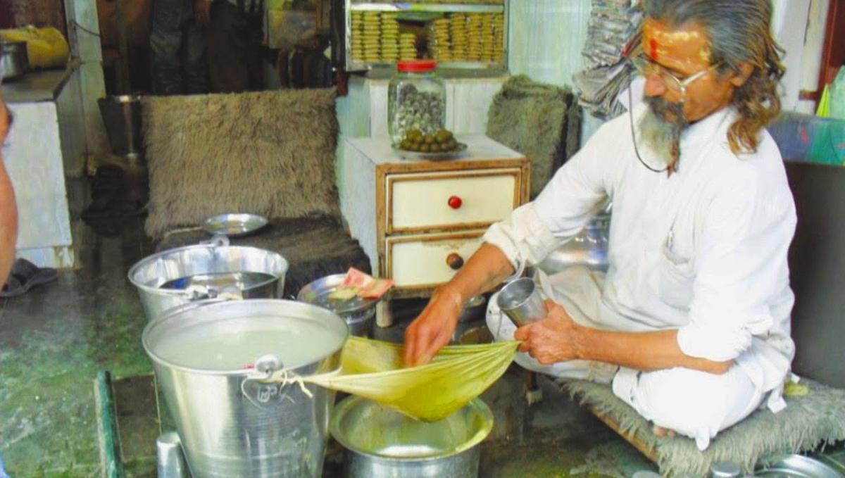 Indian man making plants bhang.