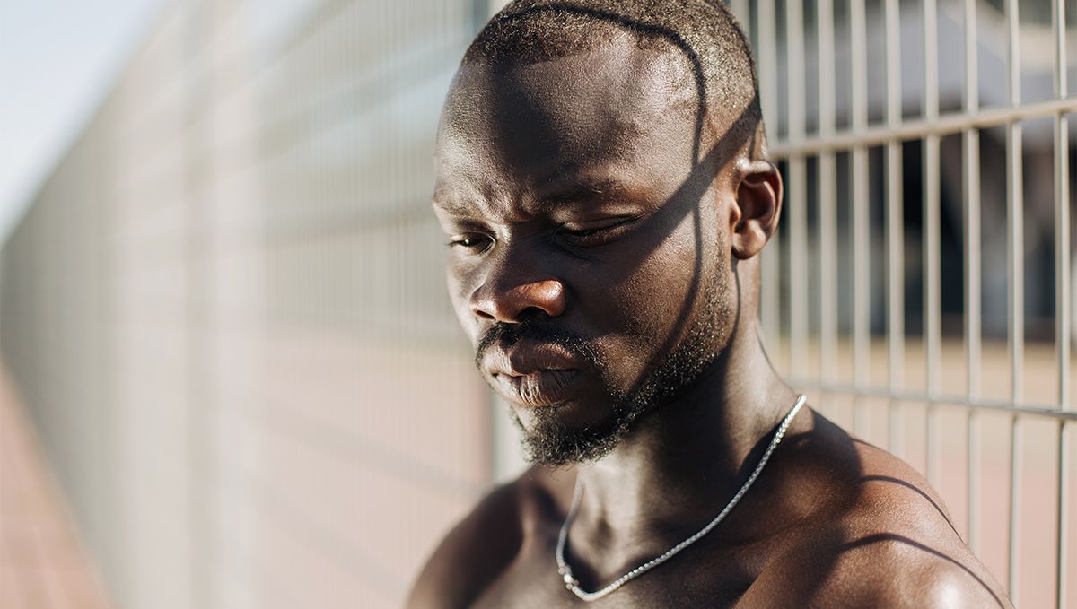 Weed in the Bahamas: Cannabis Legal Status Guide: A black young man in a prison